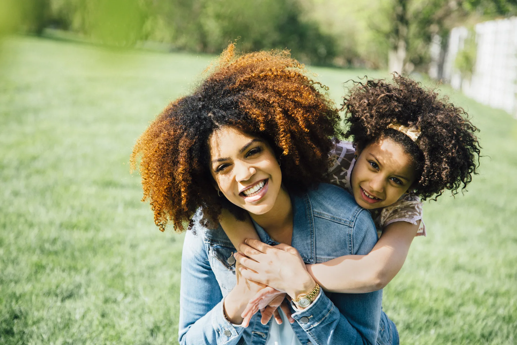 Mother and child embracing outdoors